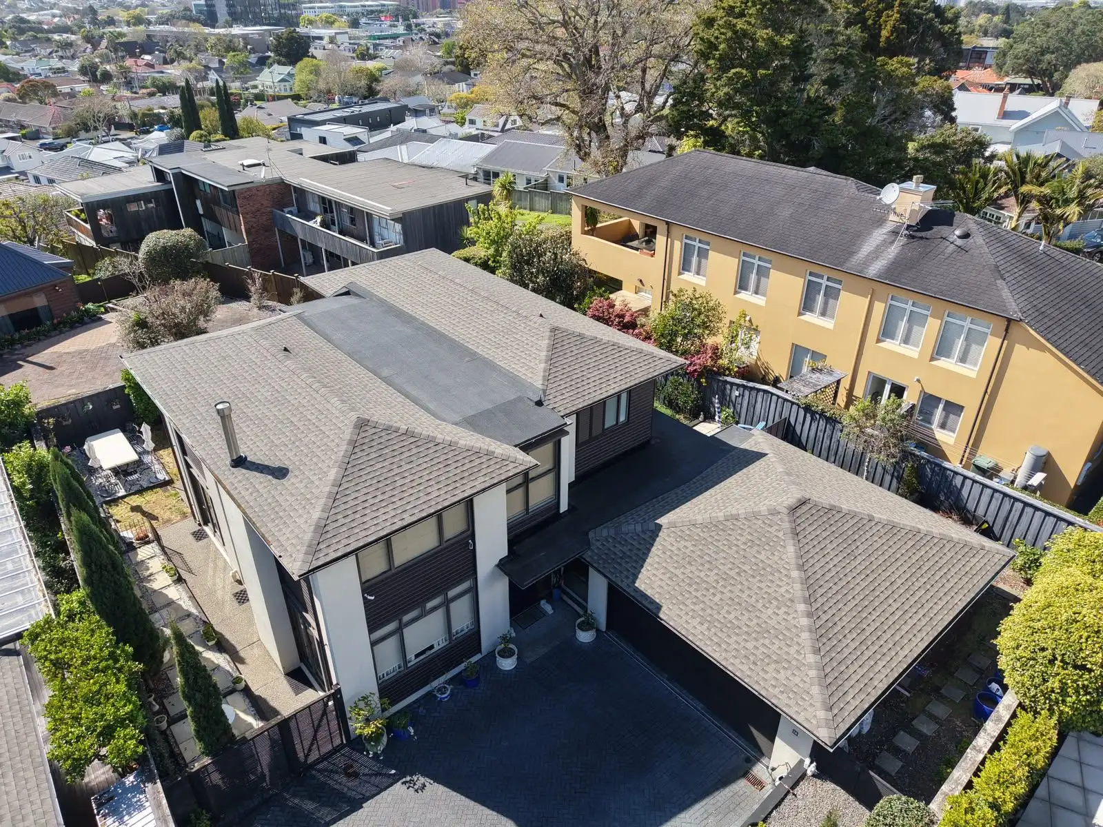 Aerial view of roofs across an Auckland suburb