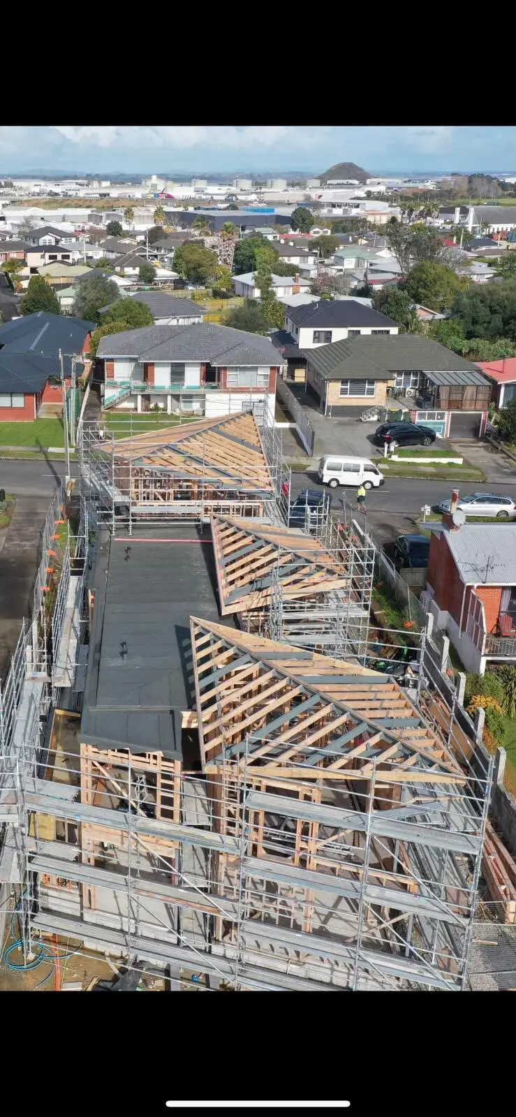 Aerial view of townhouse framing under construction in Auckland