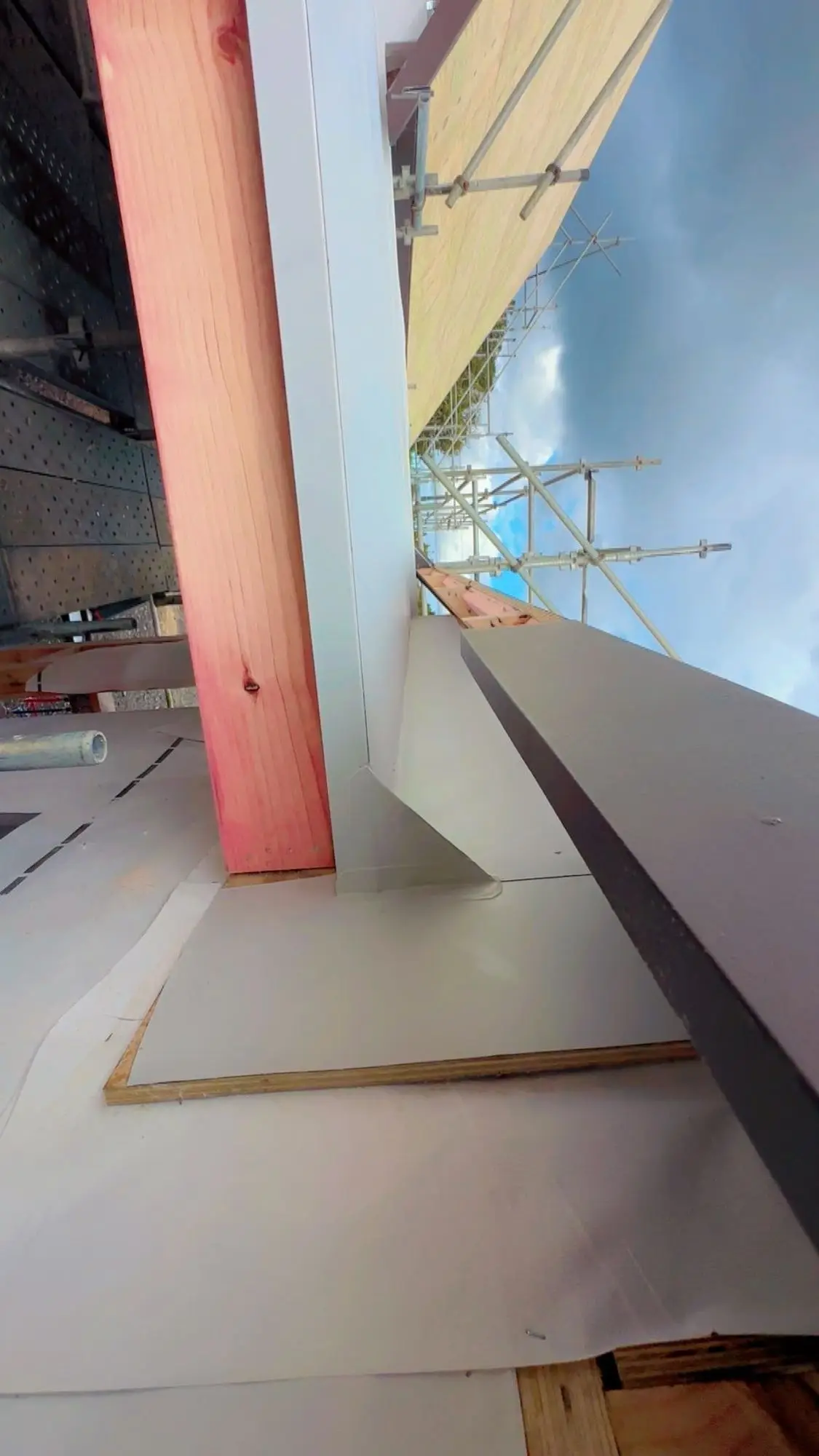 Apron flashing dressed against timber framing