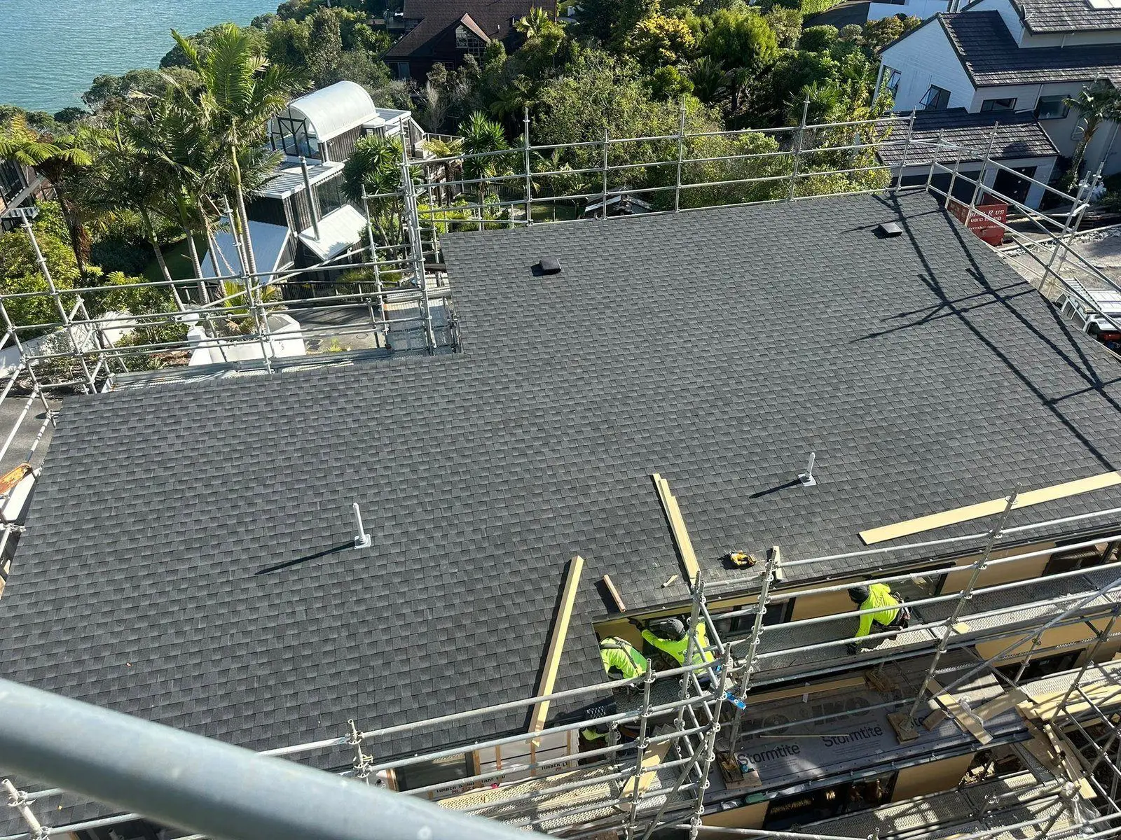 Asphalt shingle roof installation underway in West Auckland