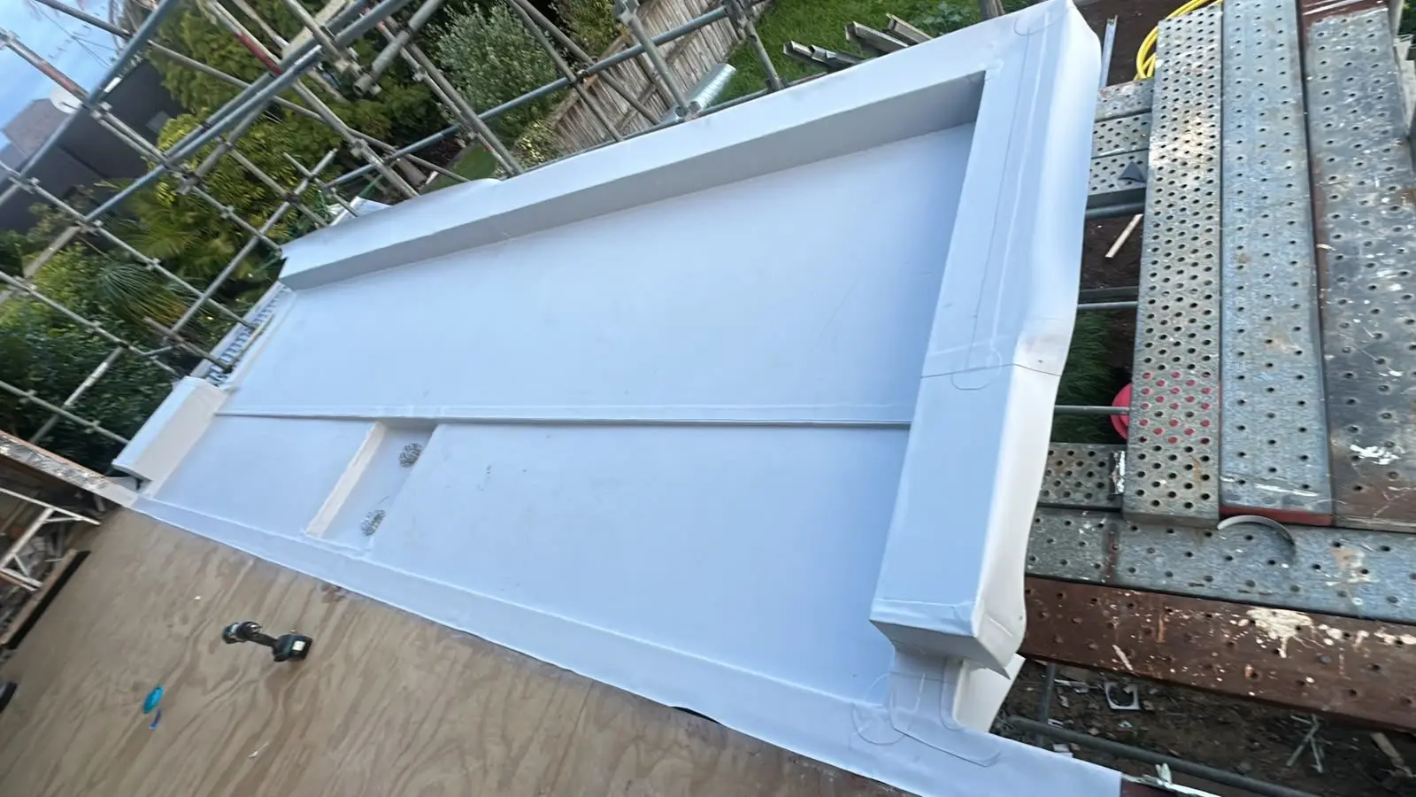 Custom folded flashing cap ready for installation on scaffolding