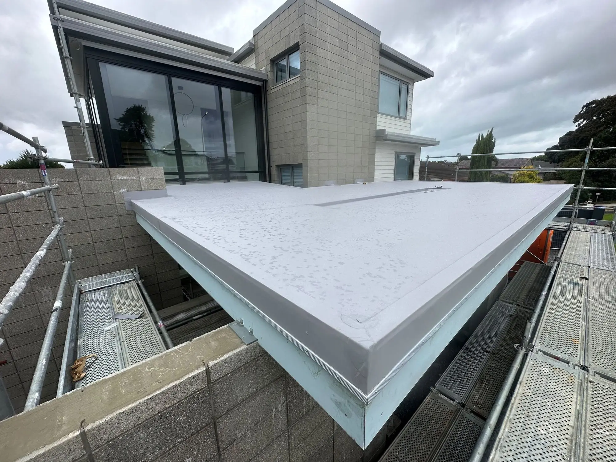Membrane parapet corner cap detail on an Auckland build