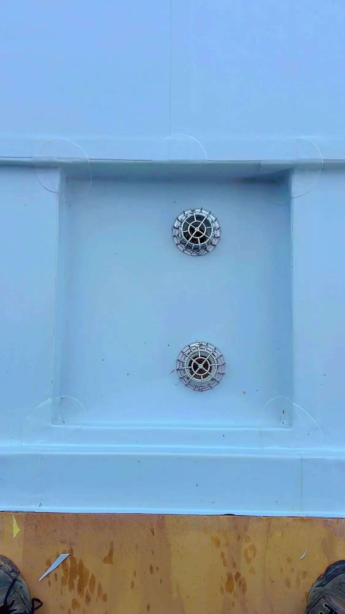 Membrane roof sump with twin outlets on a flat roof
