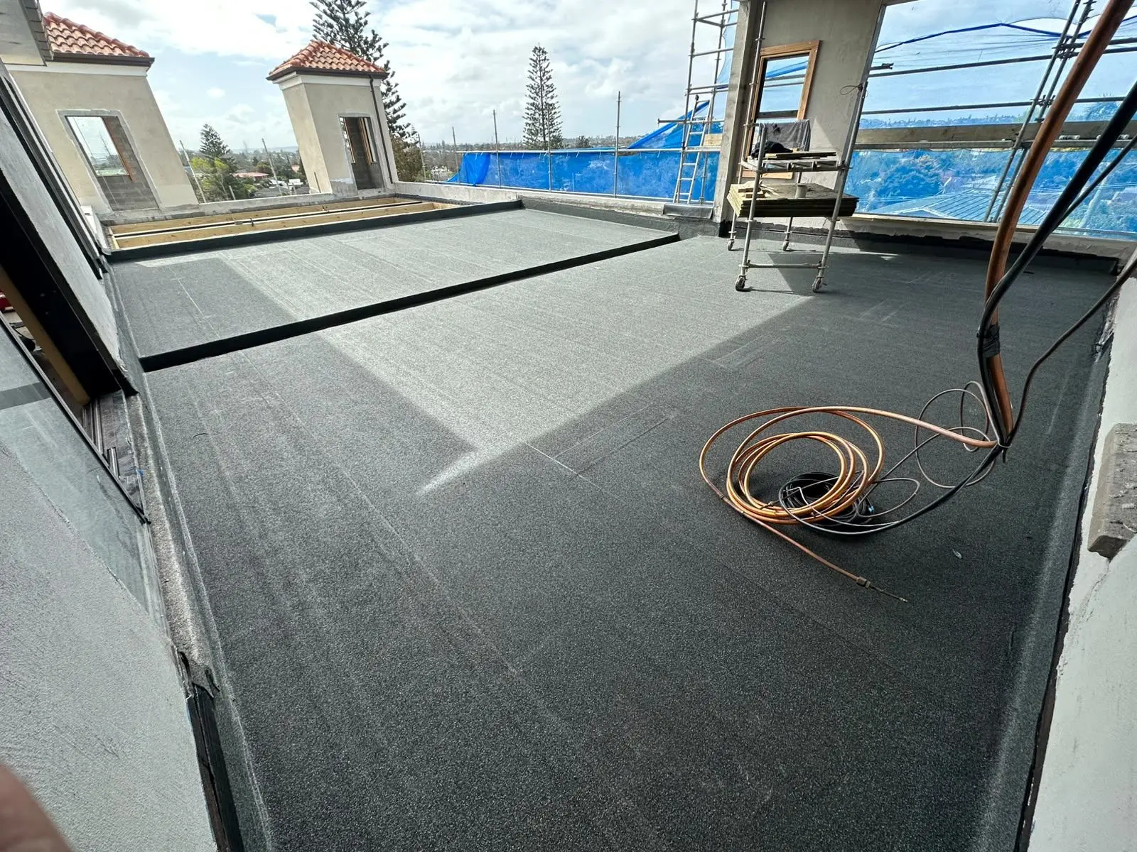 Torch-on membrane roof with skylights installed in Auckland